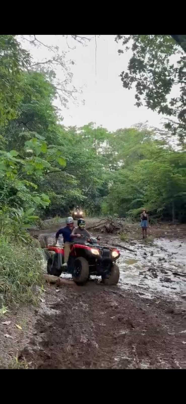 Four Wheeler crossing a muddy trail